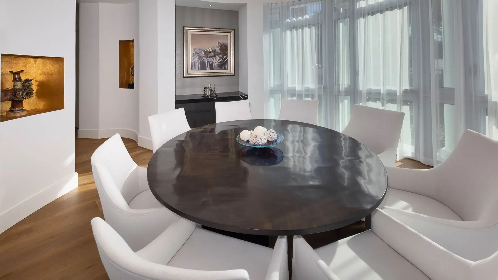 1238 Malaga — sitting room with stone fireplace and art