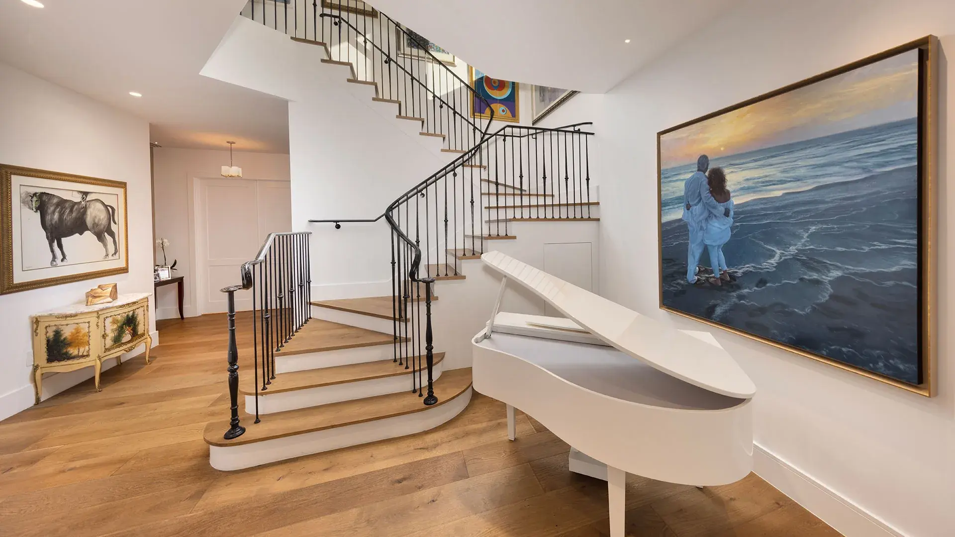 1238 Malaga — staircase with iron railing and art wall